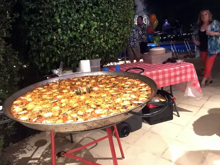 Large paella pan at an evening catered event