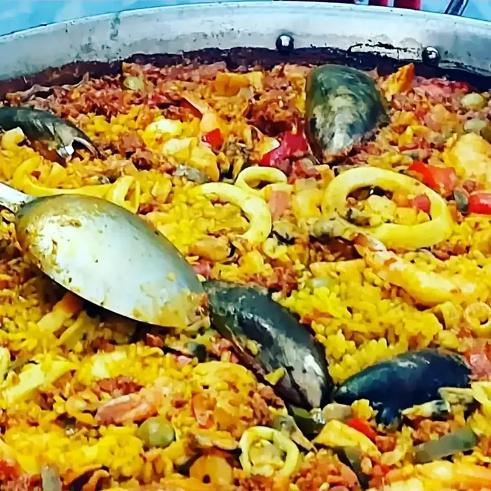Close-up of seafood paella with mussels, prawns and saffron rice