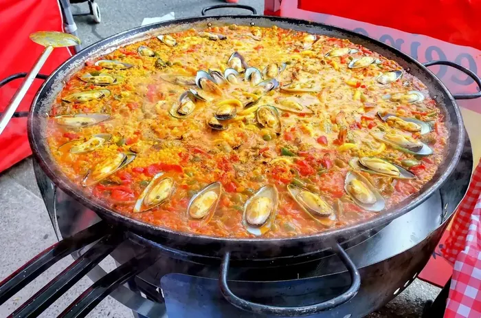 Full pan of seafood paella with prawns and mussels